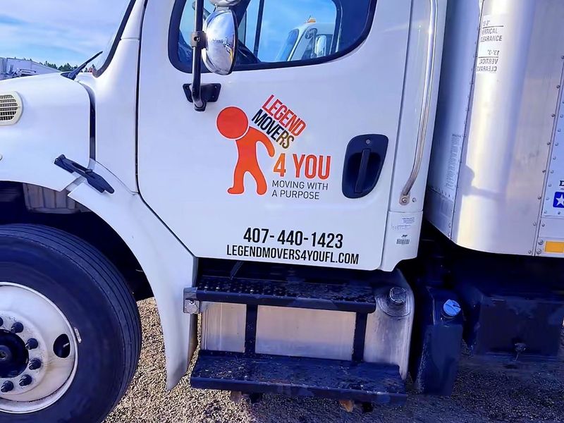 Legend Movers 4 You box truck with the company logo and phone number