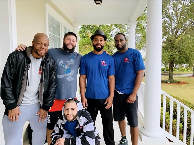Legend Movers 4 You crew on a client's porch in Central Florida